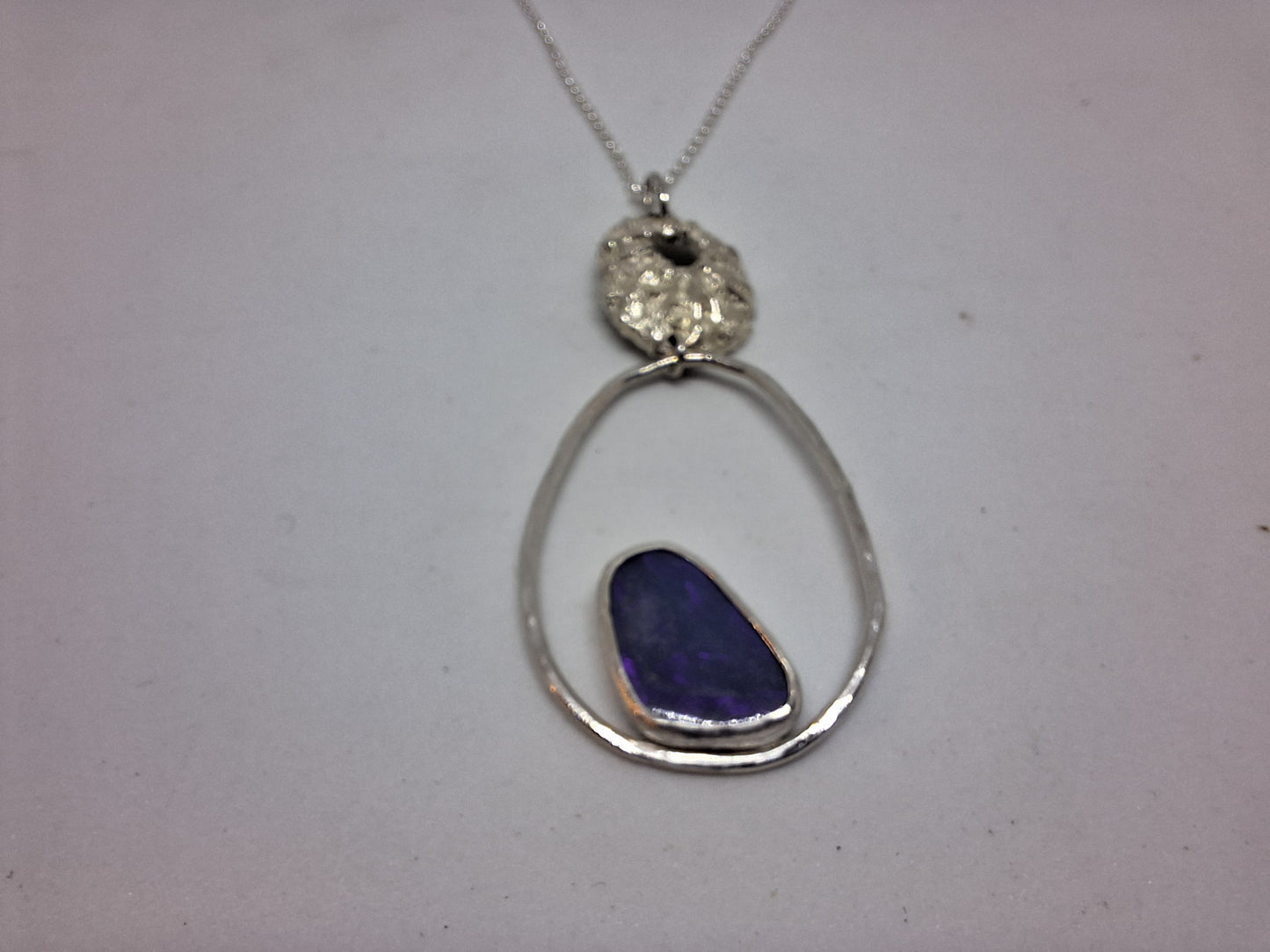 Limpet, pebble and opal pendant