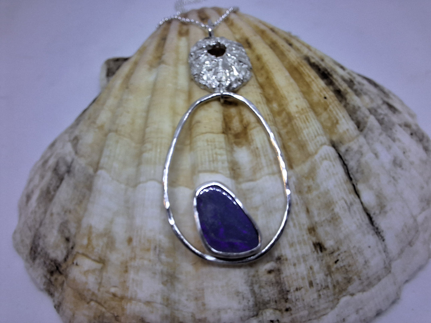 Limpet, pebble and opal pendant