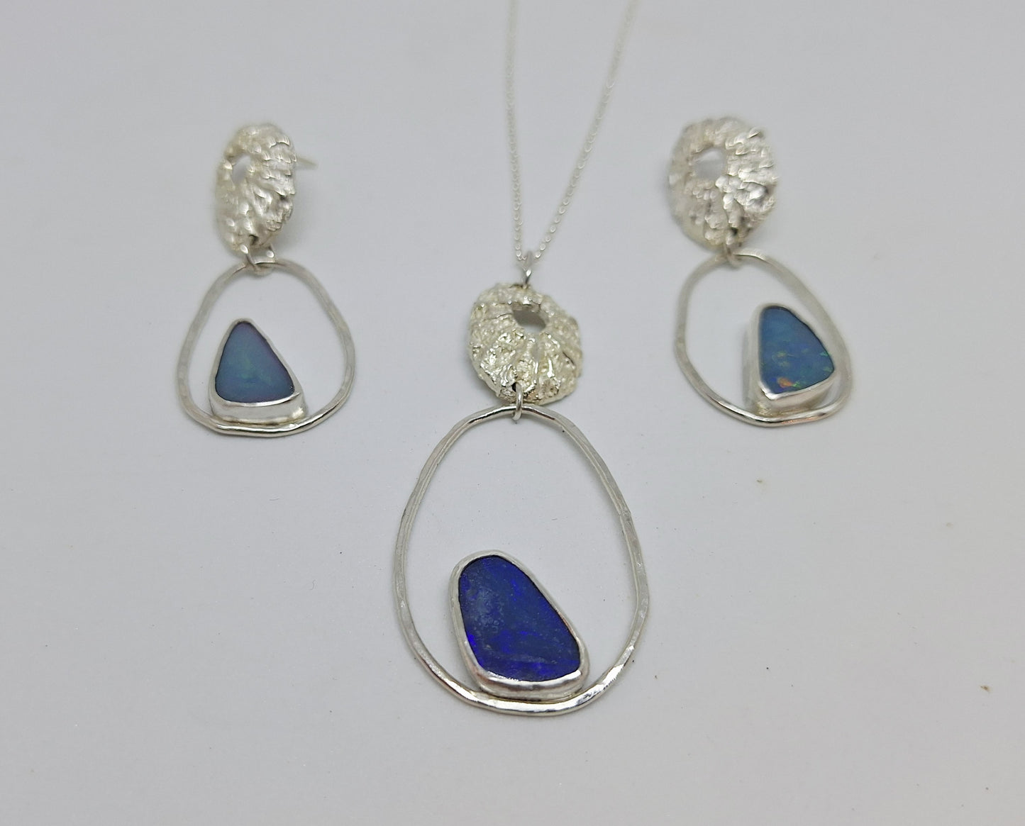 Limpet, pebble and opal pendant