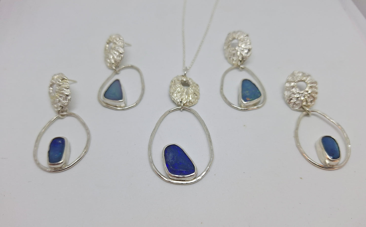 Limpet, pebble and opal pendant