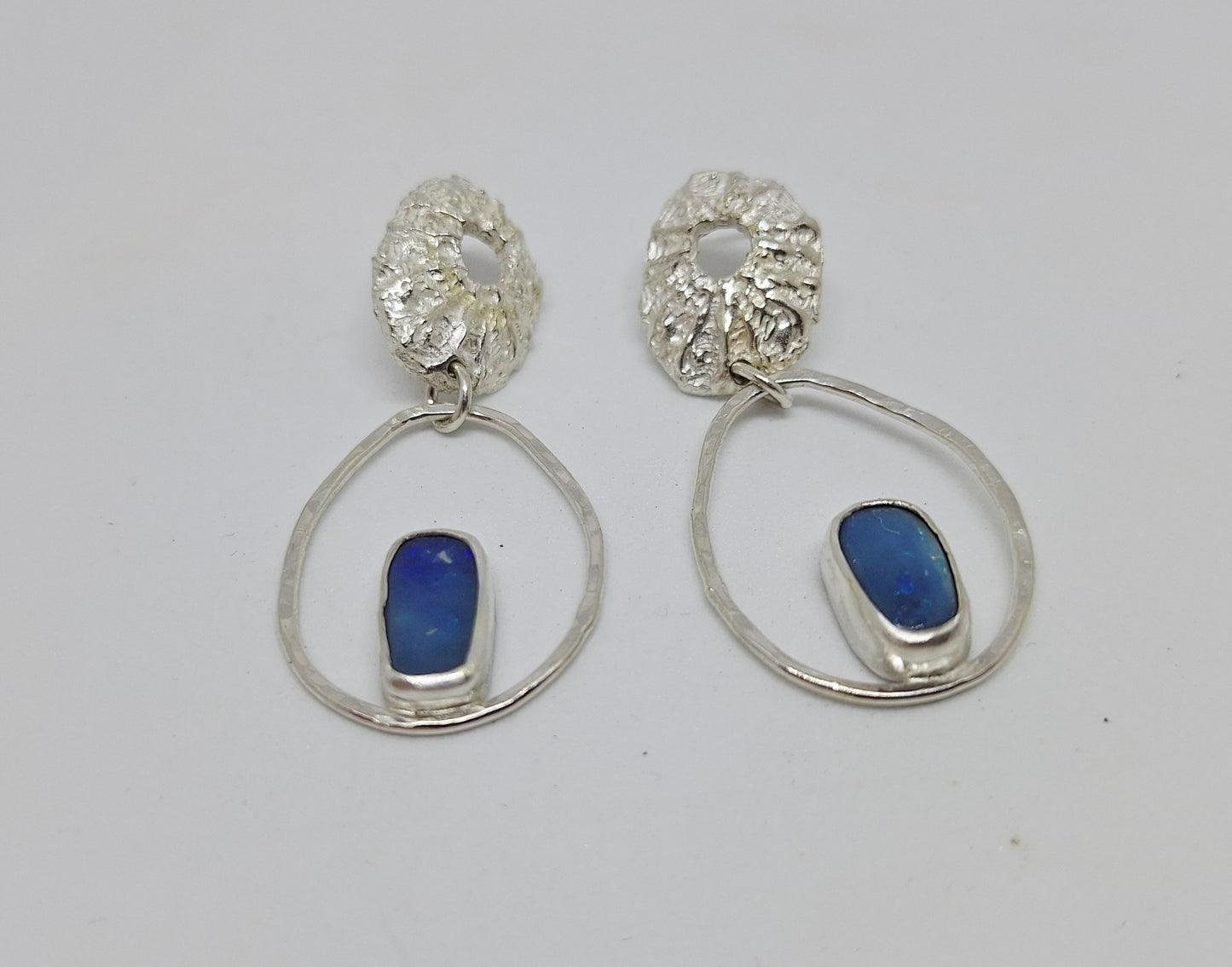 Limpet, pebble and opal stud earrings