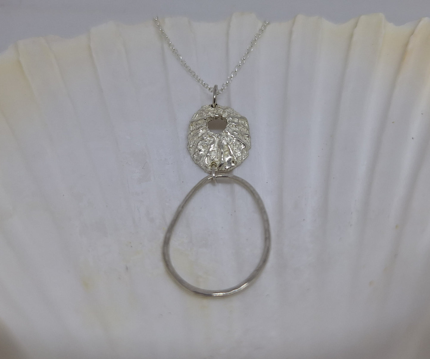 Limpet and pebble pendant
